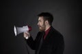 Man in Side View Holding Megaphone Royalty Free Stock Photo