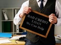 Man with sign Bad Credit Loan we can help Royalty Free Stock Photo