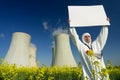 Man with sign at nuclear plant