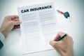 Man signing a car insurance policy Royalty Free Stock Photo