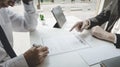 Man is signing a contract with the company, Supervisor orders the employee to sign the resignation document