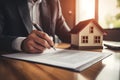 Man signing finished contract of new house Royalty Free Stock Photo