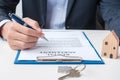 Man signing home contract documents. Contract agreement, real estate,  buy and sale and insurance concepts Royalty Free Stock Photo