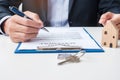 Man signing home contract documents. Contract agreement, real estate,  buy and sale and insurance concepts Royalty Free Stock Photo