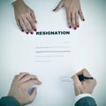 Man signing a resignation document