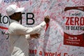 Man signing TB awareness program poster,Hyderabad,India