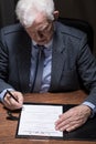 Man signing testament Royalty Free Stock Photo