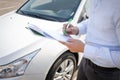 a man signs contracts on the street in close-up