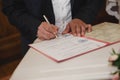 A man signs an important document Royalty Free Stock Photo