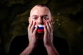Man is silenced with adhesive russian flag tape across his mouth Royalty Free Stock Photo