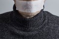 Man silenced with duct tape over his mouth on gray background Royalty Free Stock Photo