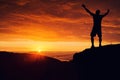 Man silhouette on the mountain top watching the sunset over clouds and forest Royalty Free Stock Photo