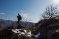 Man silhouette stay on sharp rock peak. Satisfy hiker enjoy view