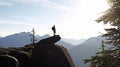 Man silhouette stay on sharp rock peak. Satisfy hiker enjoy view. Tall man on rocky cliff watching down to landscape. Generative