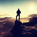 Man silhouette stay on sharp rock peak. Satisfy hiker enjoy view. Royalty Free Stock Photo