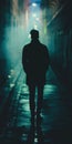 Man silhouette walking in a dark urban alley at night. Royalty Free Stock Photo