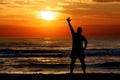 Man silhouette waving sun sunset sea Royalty Free Stock Photo