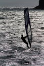 Man in silhouette wind surfing.