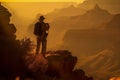 Man silhouetted against Grand Canyon sunset panorama from cliff top Royalty Free Stock Photo