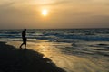 A man silhoutted on Kotu Beach, Gambia Royalty Free Stock Photo