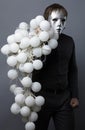 Man in a silver mask with a sheaf of nock bolls Royalty Free Stock Photo