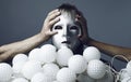 Man in a silver mask with a sheaf of nock bolls Royalty Free Stock Photo