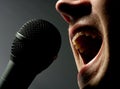 Man singing to microphone Royalty Free Stock Photo