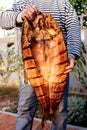 Man holds silver carp in his hands