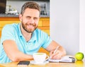 Man sit eat green apple fruit. Coffee and fruit recharge energy reserve. Healthy habits. Healthy man care vitamin Royalty Free Stock Photo