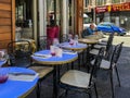 Man sits alone at cafe tables outside Paris restaurant