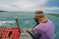 Man sits at boat and looking at the sea.