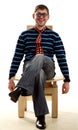 Man sits on the chair in funny glasses and tie Royalty Free Stock Photo