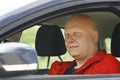 Man Sits In Driver's Seat And Looking Out Window