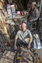 man sits in front of his tooling shop at the street in old Delhi, Chawri Bazaar