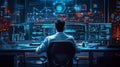 A man sits in front of multiple computer monitors, each displaying different data Royalty Free Stock Photo