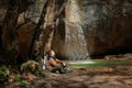 Man sits near Kozyrek waterfall in Crimea