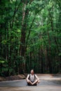 Man sits on road, Bilar Man-Made Forest, Bohol, Philippines Royalty Free Stock Photo