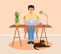 Man sits at a table, works at a computer at home. Remote work, freelance, home office, programming, training. Cozy Royalty Free Stock Photo