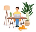 Man sits at a table, works at a computer at home. Remote work, freelance, home office, programming, training. Cozy Royalty Free Stock Photo