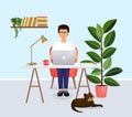 Man sits at a table, works at a computer at home. Remote work, freelance, home office, programming, training. Cozy Royalty Free Stock Photo