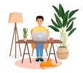 Man sits at a table, works at a computer at home. Remote work, freelance, home office, programming, training. Cozy Royalty Free Stock Photo