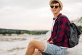 Man sits on the top of the mountain and enjoys the amazing view of the mountains Royalty Free Stock Photo