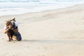 Man sitting alone with hipster hiker backpack and holding camera