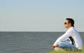 Man sitting alone and looking to the sea Royalty Free Stock Photo