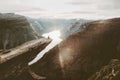 Man sitting alone on Trolltunga cliff edge in Norway Royalty Free Stock Photo