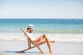 Man sitting on armchair at beach Royalty Free Stock Photo