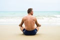 Man sitting on beach.