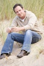 Man sitting on beach Royalty Free Stock Photo