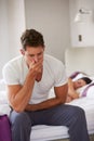 Man Sitting On Bed And Feeling Unwell Royalty Free Stock Photo