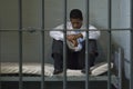 Man Sitting On Bed In Prison Cell Royalty Free Stock Photo